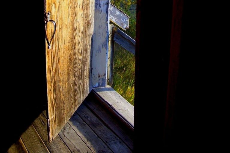 An old door, opening to the outside world