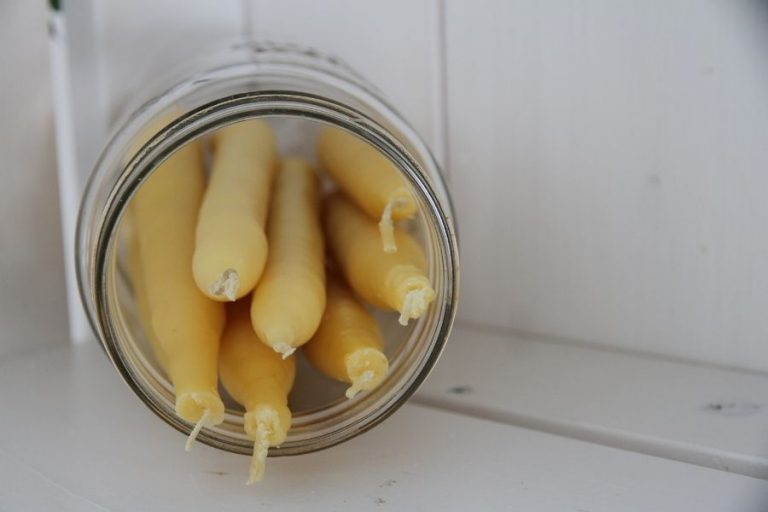 A jar filled with homemade beeswax candles!