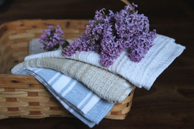 a basket draped with freshly washed tea towels