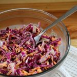 healthy homemade coleslaw in a glass bowl