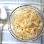 A small bowl of fermented sauerkraut with garlic and dill