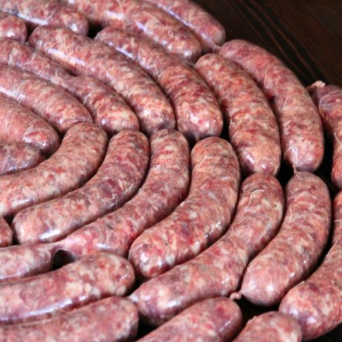 A neat coil of homemade venison sausage links