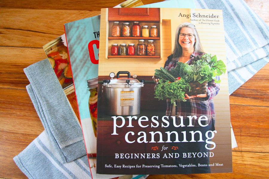 A pressure canning cookbook on the kitchen counter.