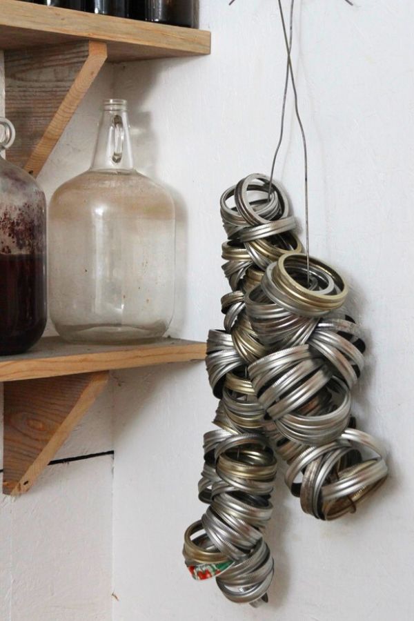 Wide mouth and standard mouth canning bands hanging on the wall in my canning room.