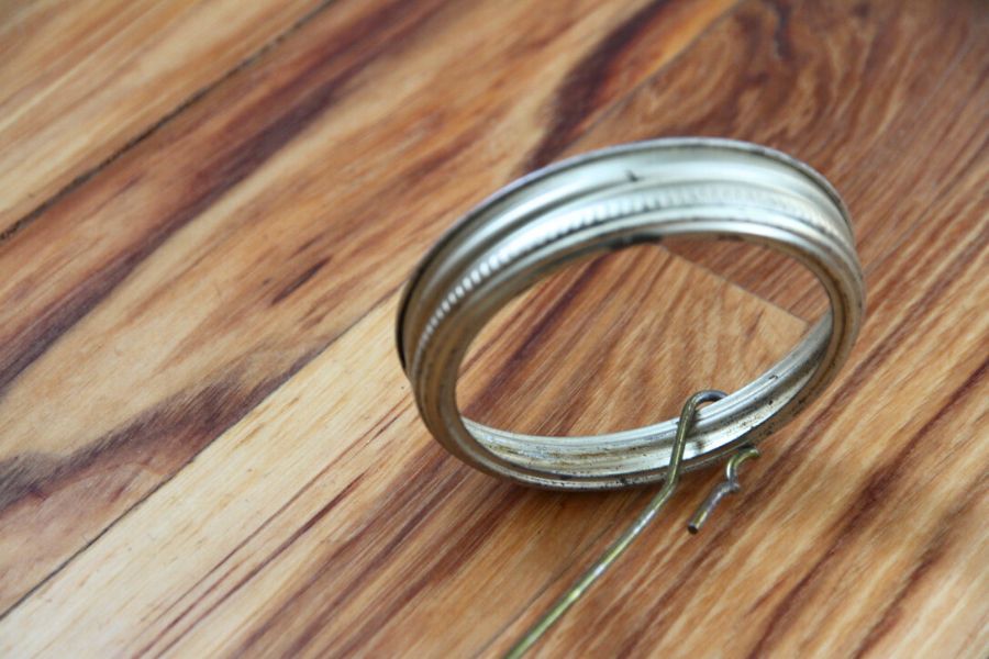 Straightened wire from a coat hanger twisted around a single canning ring.