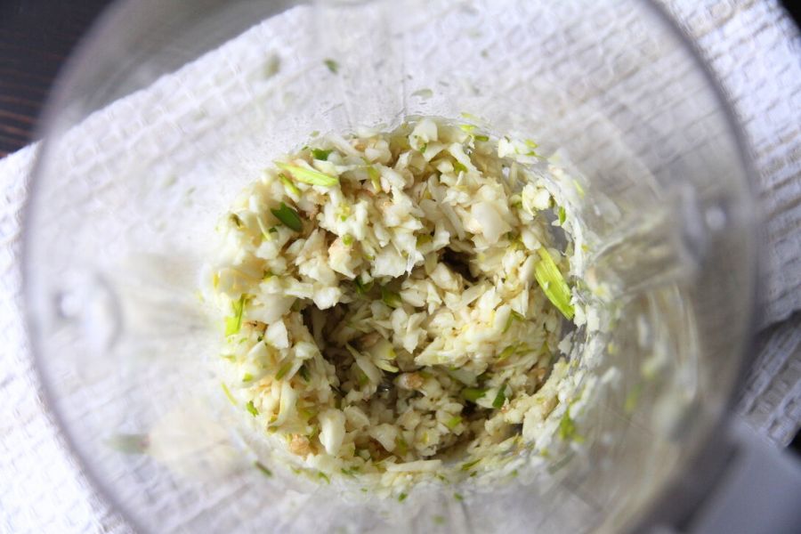 Lightly minced garlic in the bottom of my kitchen blender.