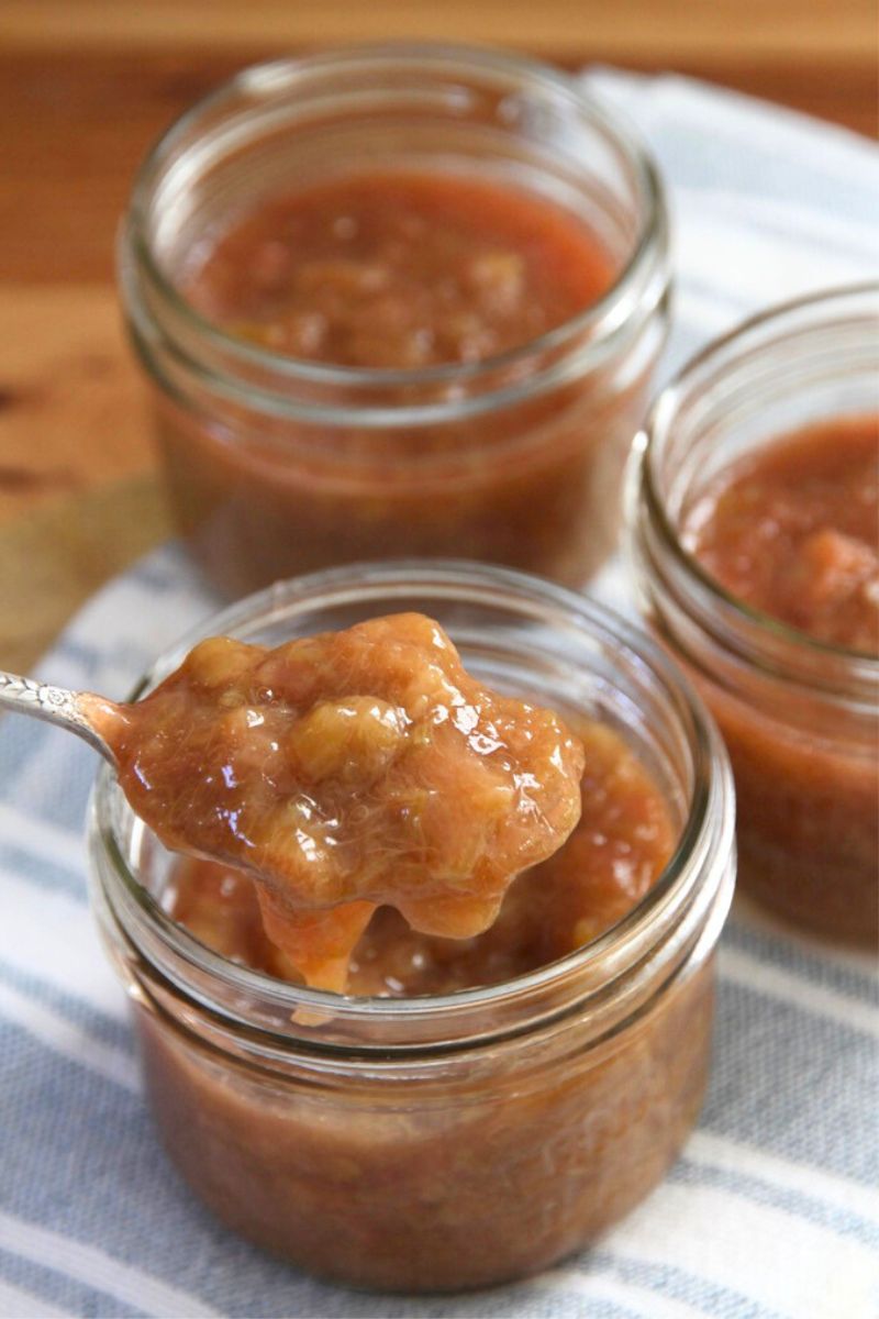 Small jars filled with homemade rhubarb jam.