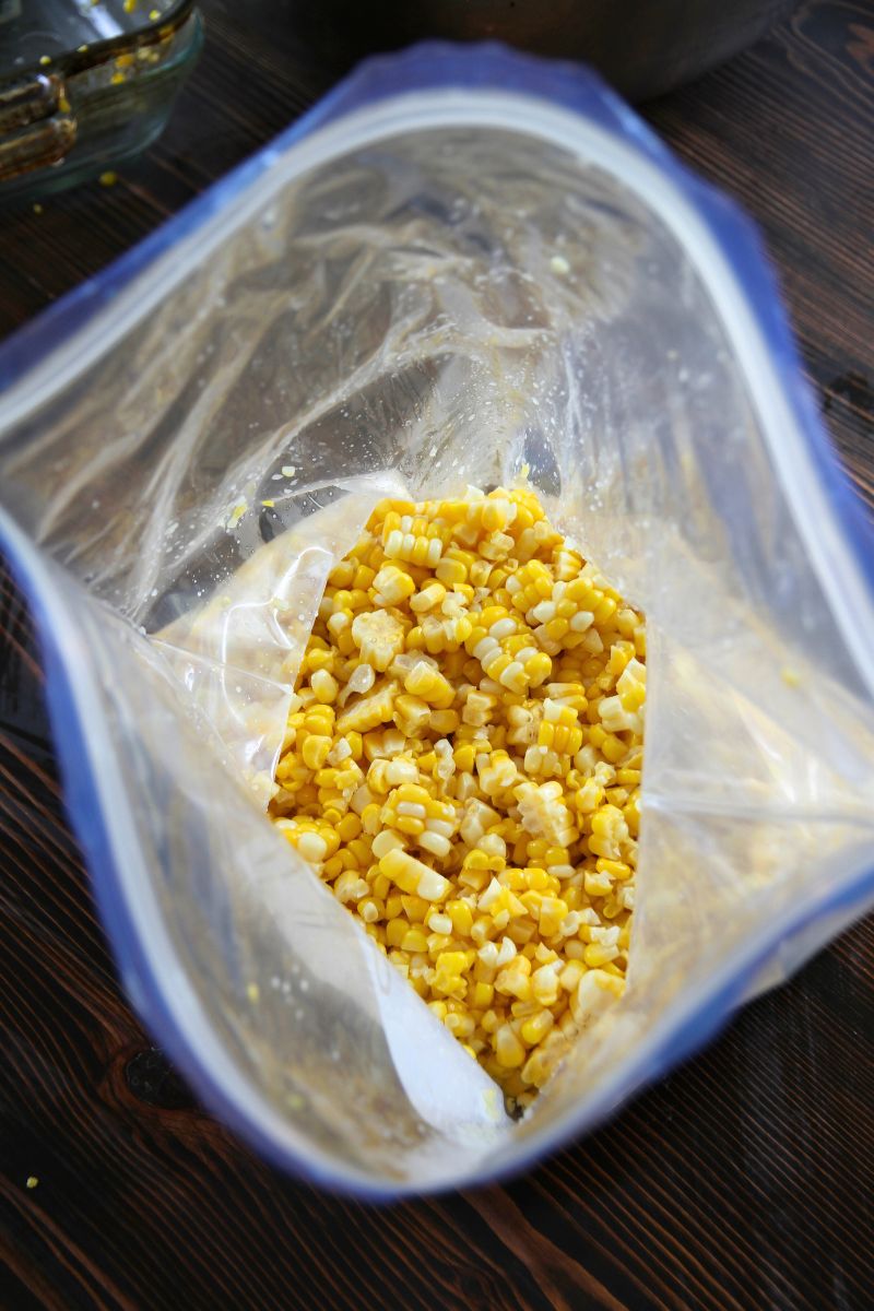 A zip loc plastic bag filled with sweet corn kernels that can be frozen and will retain their fresh taste.
