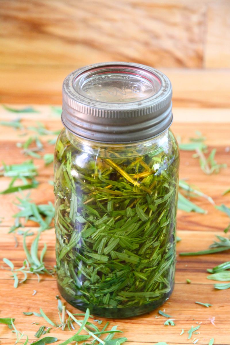 A jar of fresh lavender with oil, ready to sit and infuse.