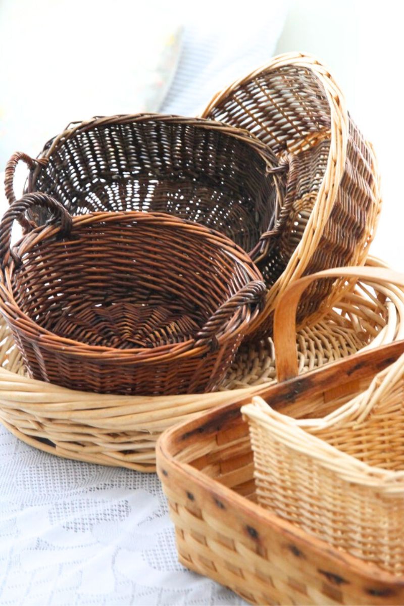 A pile of freshly washed wicker baskets, drying on a kitchen table. 