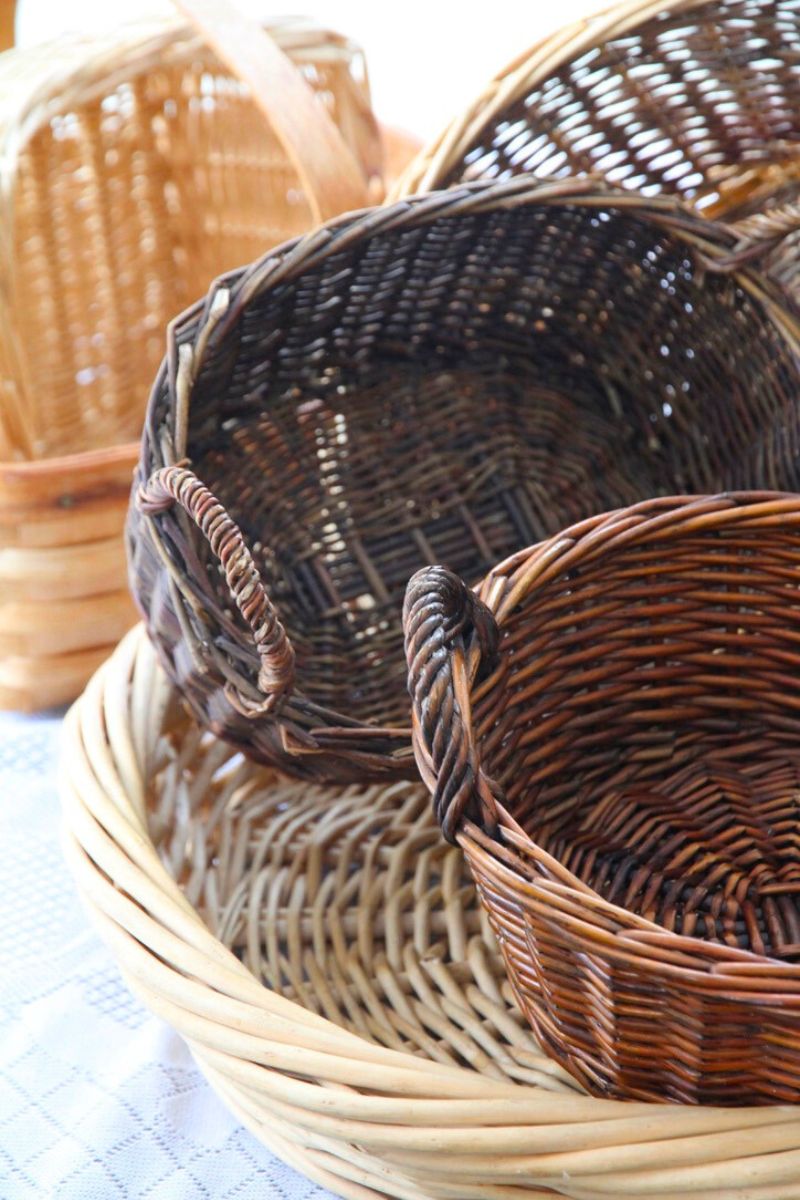 Stacked wicker baskets on a kitchen table, ready to be added into my kitchen decor.