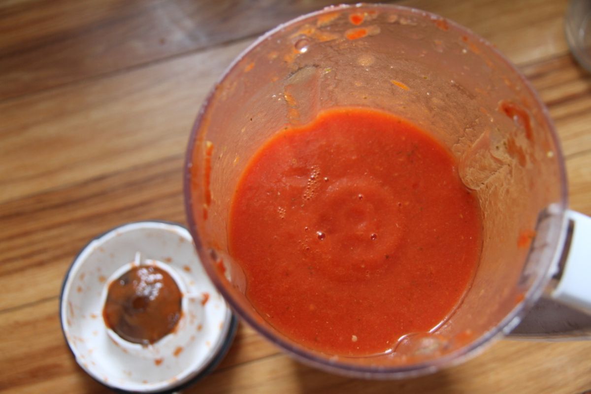 Freshly pureed red tomato sauce in a Bosch kitchen blender.