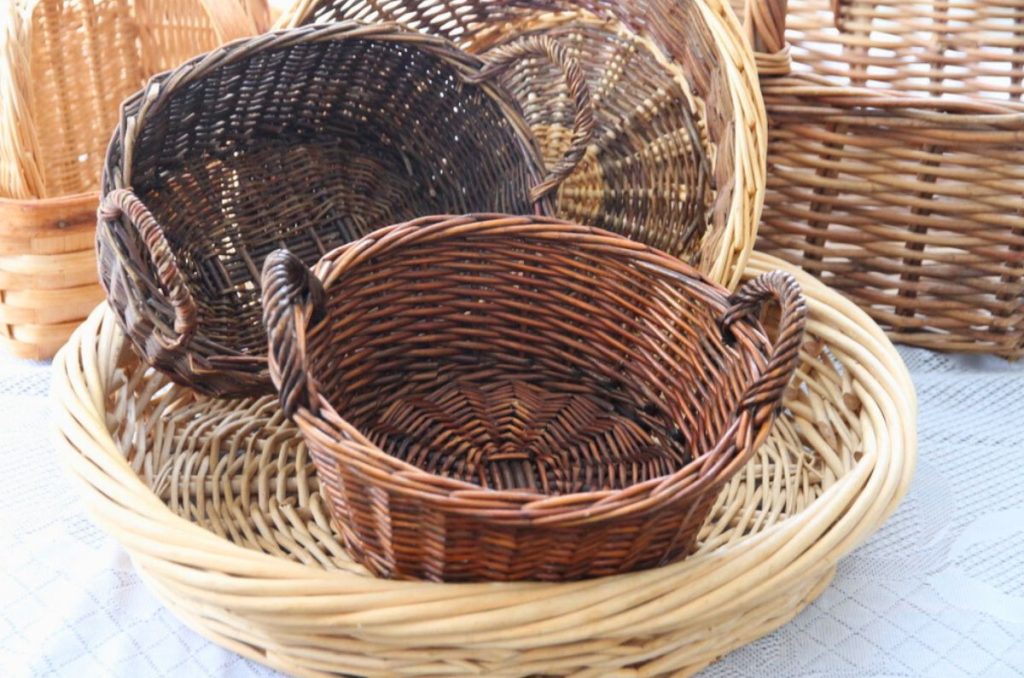 A wicker baskets collection of round rattan baskets on a kitchen table
