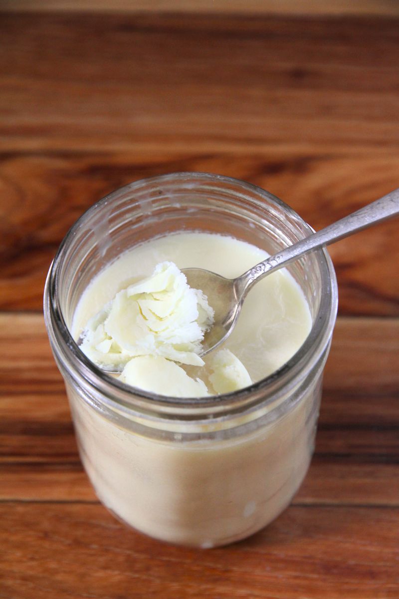 Tallow in a jar with a spoon for cast iron cooking and seasoning.
