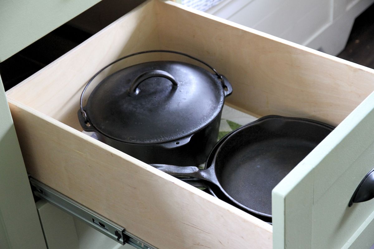 Cast iron stacked in strong kitchen drawer.