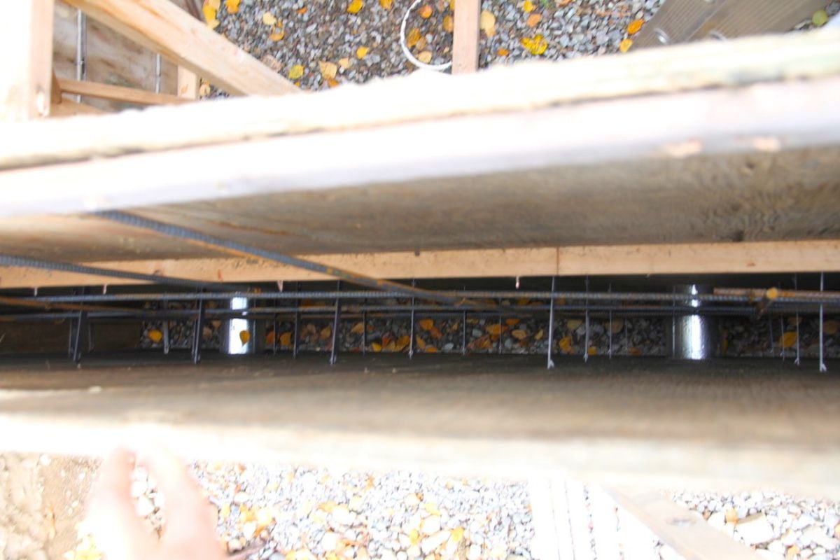 The inside of the concrete wall forms, showing rebar, venting block outs of sheet metal and quick strip ties.