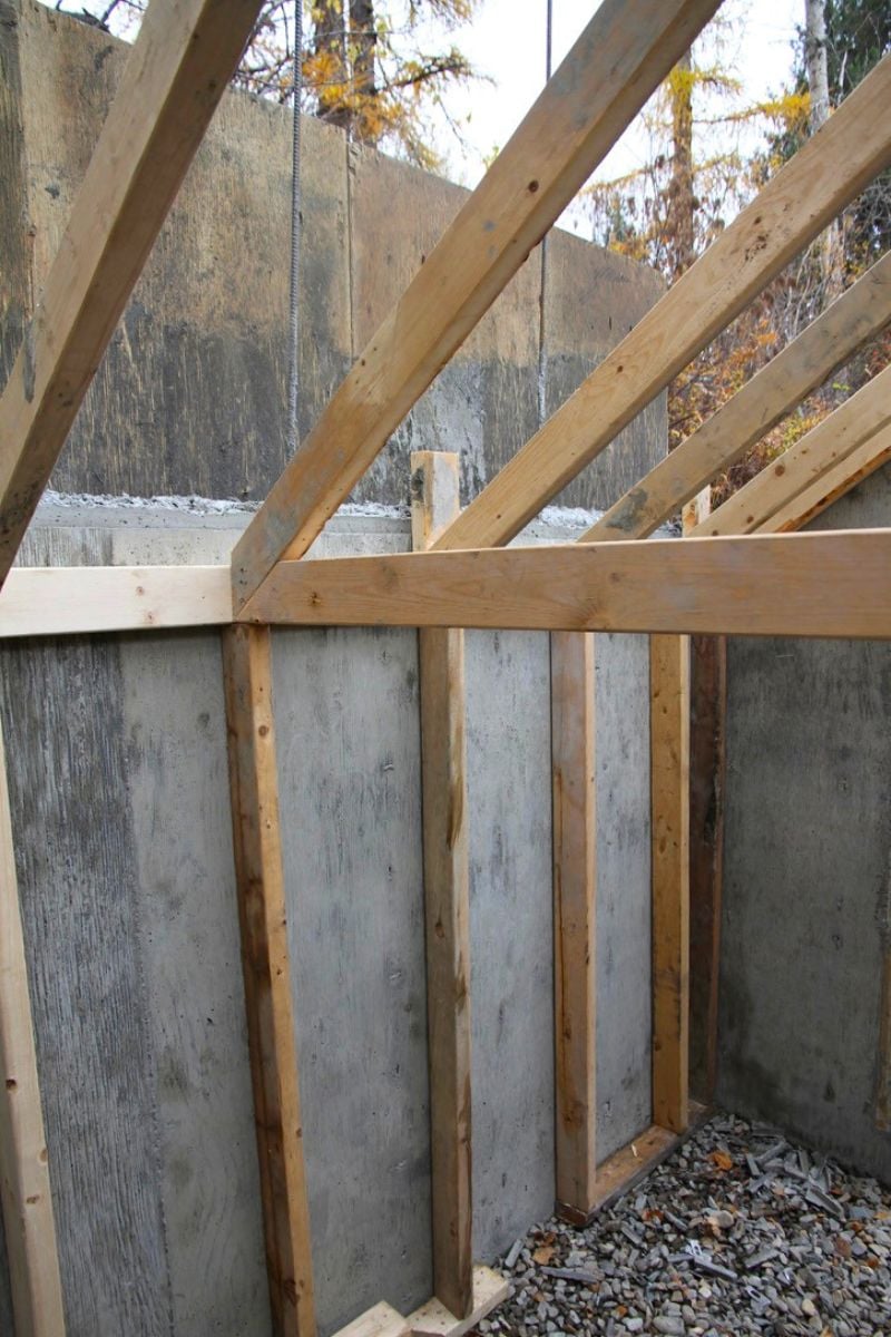 Trusses to hold forms for the concrete root cellar roof. 
