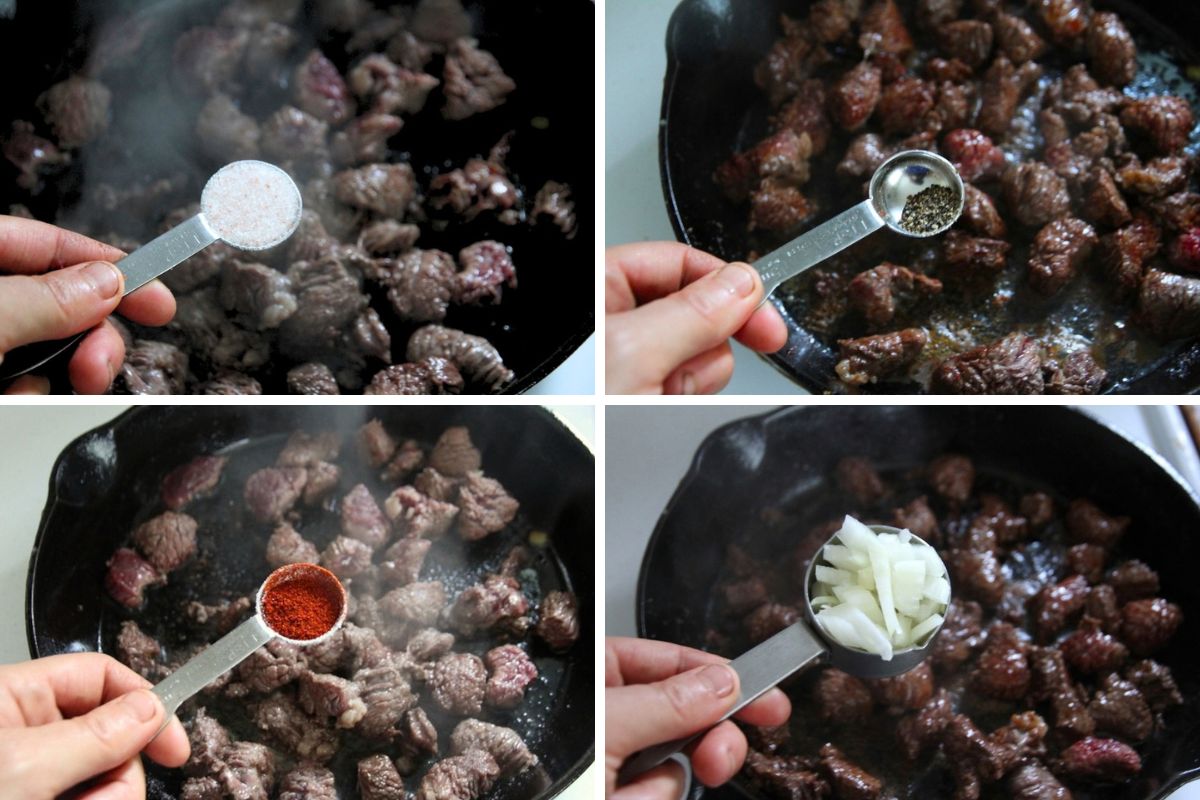 Four different spices and flavorings being added to bear meat: salt, black pepper, paprika and onion.
